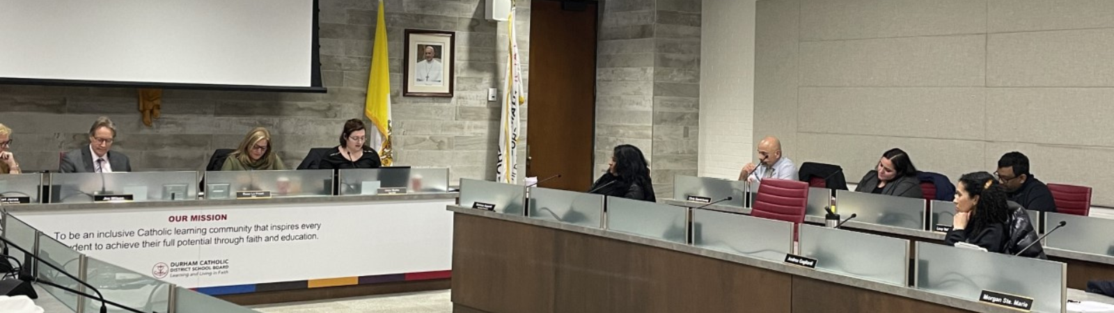 Recording secretary, Superintendent of Education, Chair and Vice-Chair in the boardroom